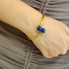 Bracelet in 18 K gold, handmade, hammered with lapis lazuli, 1254.