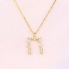 Monogram necklace excite, silver goldplated, 1996.