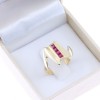 14 K ring in a modern design with small rubies, 2319.